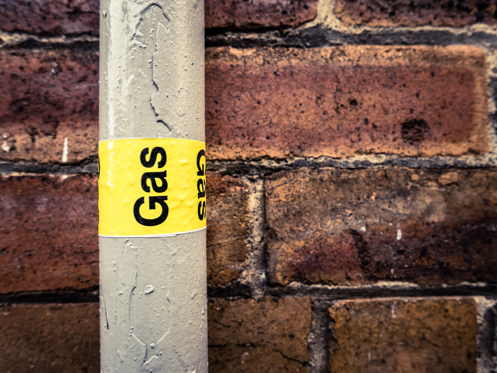 A gas line on the exterior of a house