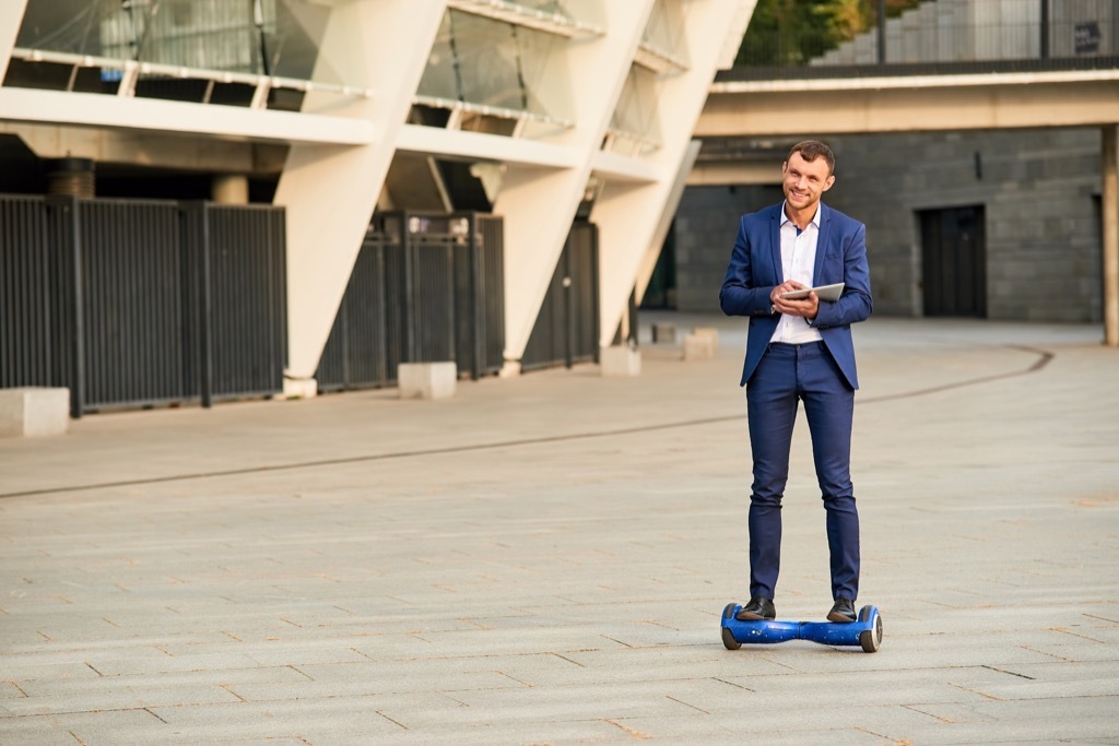 Man over 40 on a hoverboard