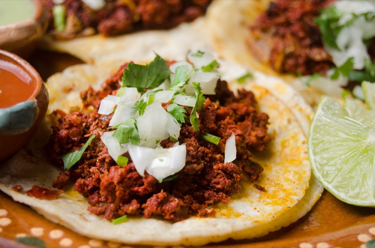 taco with ground chorizo and chopped onion