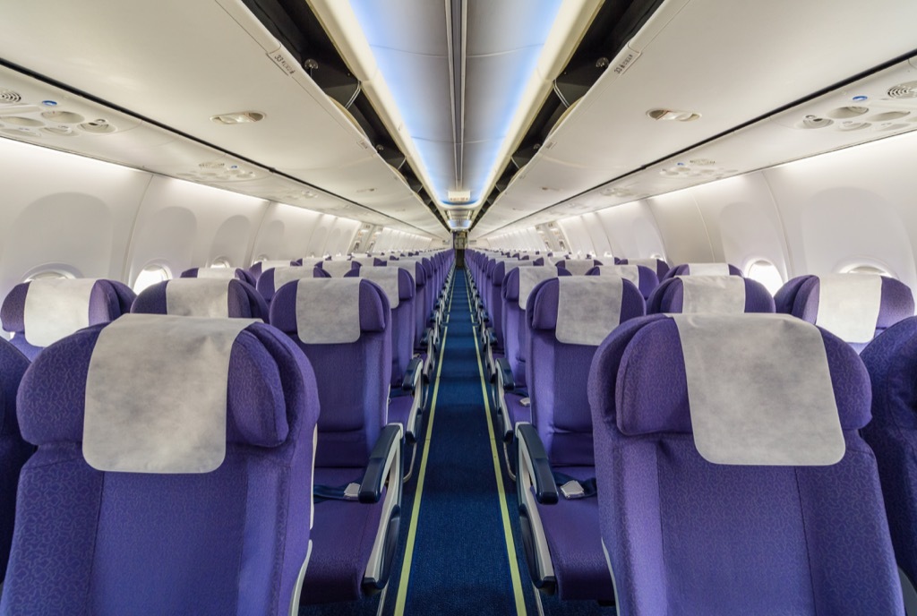 Airplane aisle, which is dirty and disgusting. 