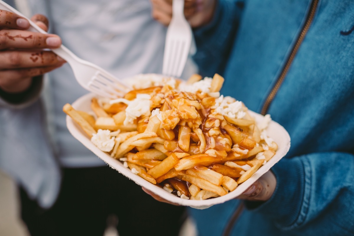 People Eating Poutine Canadian Traditions