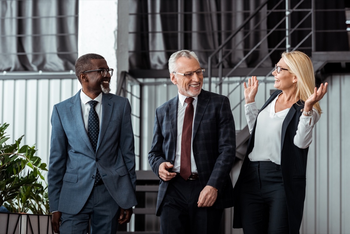 happy businesswoman gesturing while smiling