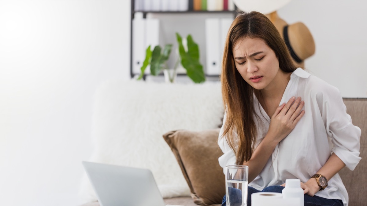 Woman having heart pain