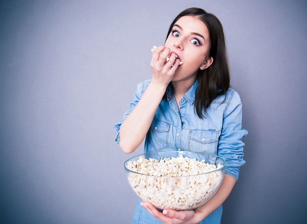 woman eating popcorn